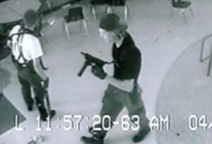 Eric Harris and Dylan Klebold in the cafeteria with guns
